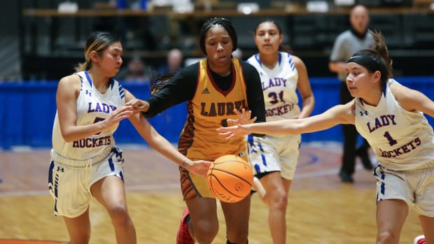 Laurel's Zoey Cooley (1), Neshoba Central's Shante Beaulieu (1) and Neshoba Central's Jalesiya Jim (5) battle for the ball. Laurel and Neshoba Central played in an MHSAA Class 2A semifinal basketball game on Tuesday, March 2, 2021 at Mississippi Coliseum. Photo by Keith Warren