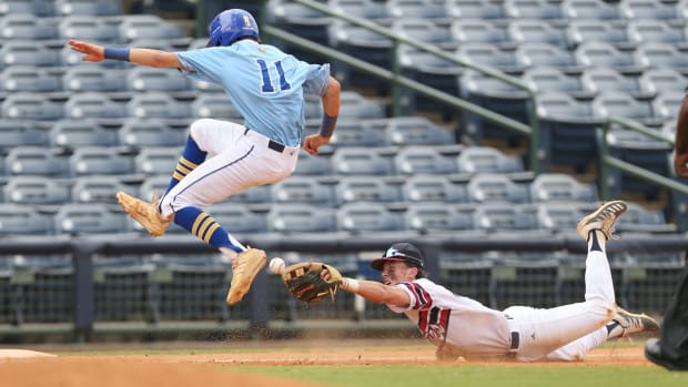 Resurrection's Luke Schnoor (11) avoids a tag by Tupelo Christian's John Paul Yates (13) at third base. Tupelo Christian and Resurrection played in game 1 of the MHSAA Class 1A Baseball Championship on Tuesday, June 1, 2021 at Trustmark Park. Photo by Keith Warren