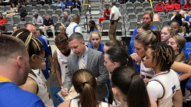 Booneville coach Michael Smith implores his team to execute in the final minutes of the Blue Devils' 33-30 win over Morton in the Semifinal Round of the MHSAA Class 3A Basketball tournament Wednesday morning at the Mississippi Coliseum.