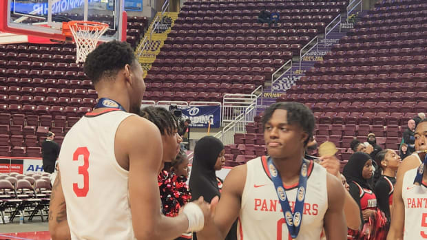 Justin Edwards (No. 3) and Ahmad Nowell (No.0) celebrate after Imhotep Charter won the 2023 Class 5A state championship