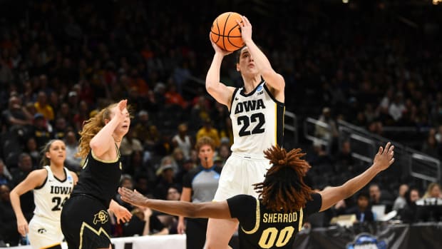 Iowa's Caitlin Clark produces first 40-point triple-double in NCAA tournament history as Hawkeyes eliminated Hailey Van Lith and Louisville on Sunday night in Seattle.