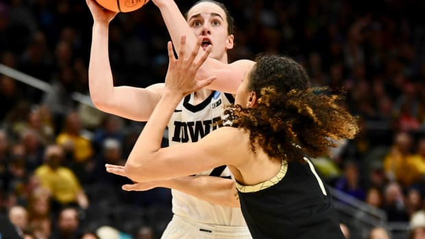 Iowa's Caitlin Clark with first 40-point triple-double in NCAA Tournament history as Hawkeyes eliminate Hailey Van Lith and Louisville on Sunday night in Seattle.