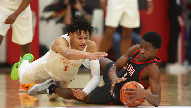 Dec 10, 2022; Scottsdale, AZ, USA; Wasatch Academy guard Isiah Harwell (left) dives for a loose ball against Long Island Lutheran guard VJ Edgecombe during the HoopHall West basketball tournament at Chaparral High School. Mandatory Credit: Mark J. Rebilas-USA TODAY Sports