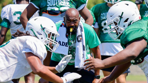 St. Mary's football coach Ken Turner watches closely during a practice drill.