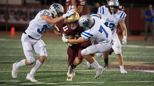 Brookwood senior Miles Massengill, who caught nine balls for 120 yards, secures the football as he is being tackled by South Forsyth’s Hayden Mock (37) and James Margiotta (7).