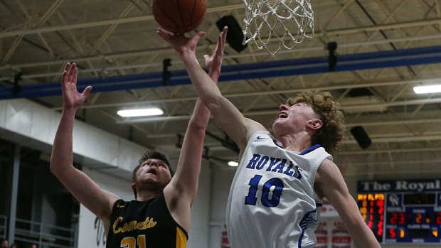 Colo-Nesco guard Jack Angell (10) goes for a rebound around BCLUW forward Hayden Schleisman (21) during the second quarter at Colo Nesco High School gym on Friday, January 26, 2024, in Colo, Iowa.