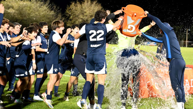 Gulliver Prep players drench their head coach Scott Davidson with a Gatorade bath after winning the Class 4A boys soccer state championship on Saturday at Lake Myrtle Park in Auburndale with a 1-0 win over Orlando Bishop Moore.