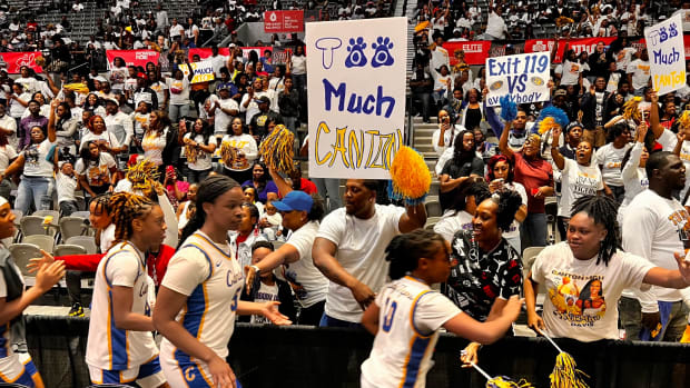 The Canton Lady Tigers celebrate with their fans following a semifinal win over Florence in the 2024 MHSAA Class 5A Girls State Basketball Tournament on Tuesday, Feb. 27 at the Mississippi Coliseum.