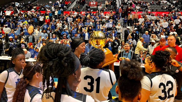 The Blue Mountain Lady Cougars celebrate their 2024 MHSAA Class 1A Championship on Feb. 29, 2024 at the Mississippi Coliseum in Jackson, Miss.