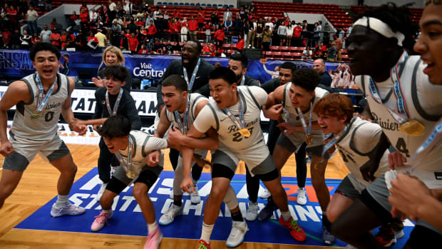 Riviera Prep players celebrate after winning the Class 3A state championship trophy by beating Windermere Prep for the second straight season in the state final.