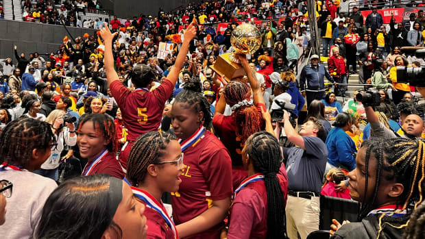 The Laurel Lady Golden Tornadoes hoist the 2024 MHSAA Class 5A State Championship Trophy after defeating Canton 50-42 on Friday, March 1, 2024 at the Mississippi Coliseum.
