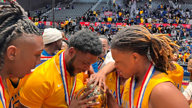 The Canton Tigers celebrate the 2024 MHSAA Class 5A State Championship after defeating Yazoo City 58-40 on March 1 at the Mississippi Coliseum.