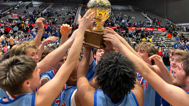 The Ingomar Falcons hoist the MHSAA Class 2A State Championship Trophy after defeating Bogue Chitto on Friday, March 1, 2024 at the Mississippi Coliseum in Jackson, Miss.