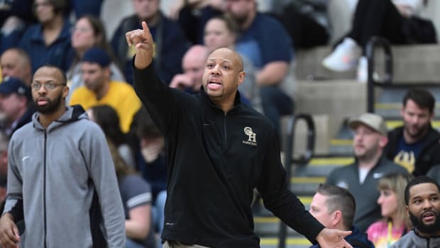 Garfield Heights head coach Sonny Johnson gives instruction to his team during. agame against North Ridgeville on March 1, 2023