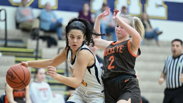 Copley's Izzy Callaway drives around a defender against Buckeye on February 21, 2024.