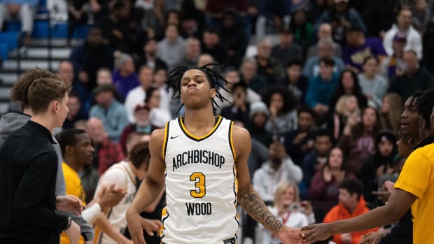 Archbishop Wood's Milan Dean enters the court after his name is called in the starting lineup before the PIAA semifinal game against Roman Catholic at Bensalem High School on Tuesday, March 21, 2023.