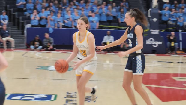 Danielle Cameron of Olmsted Falls dishes the ball to a teammate in the fourth quarter of the Bulldogs' win over Magnificat in the Division I state semifinals on March 15, 2024.