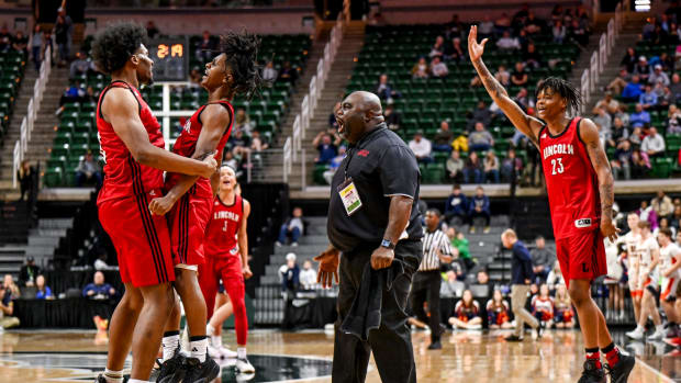Get game updates from the Michigan boys high school basketball Division 2 state championship game