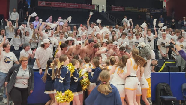 Olmsted Falls players celebrate with the student section after winning the OHSAA girls basketball Division I state title on March 16, 2024.