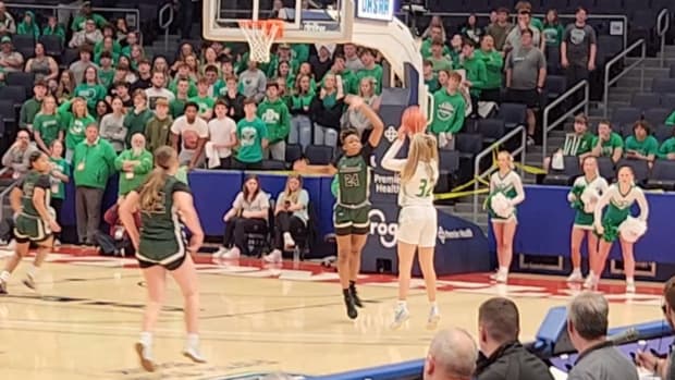 Fairland's Bailey Russell (No. 32) lets a 3-pointer fly in the state semifinals against Laurel on March 15, 2024.