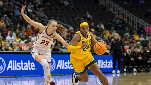 Baylor Lady Bears guard Sarah Andrews (24) handles the ball while defended by Iowa State Cyclones guard Kelsey Joens (23) during the first half at T-Mobile Center. 
