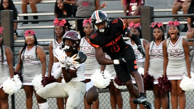 Norland wideout Terrence Honeywood has a reception broken up by Lakeland defensive back Derjah Hardy on Friday in Lakeland.
