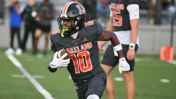 Lakeland running back Rick Penick takes off on a run during a 30-2 win against Bartow at Bryant Stadium Friday. Penick would score on a 5-yard reception later in the game.