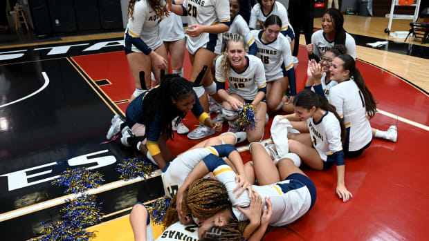 St. Thomas Aquinas players celebrate on the Polk State College floor after winning the Class 6A state championship match at the FHSAA girls volleyball state tournament on Thursday.