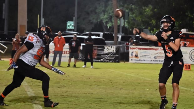 Lake Wales quarterback Brycen Levidiotis gets off a pass during a Class 3S playoff game against Leesburg.  