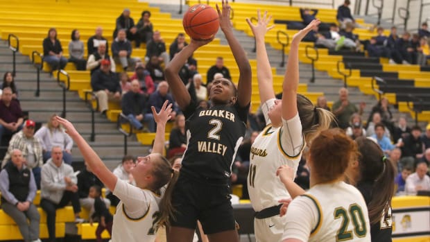 Quaker Valley's Oumou Thiero (2) goes for two points while being heavily guarded by Blackhawk's Alena Fusetti (11) and Haley Romigh (25) during the first half of the WPIAL 4A Semifinals game Tuesday night at North Allegheny High School. Blackhawk Vs Quaker Valley Wpial 4a Semifnals