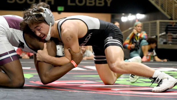 Sebastian Degennaro from Jensen Beach wins a 6-5 battle against Antonie Mills of Mill Creek during the 126-pound championship match on Saturday at the Knockout Christmas Classic at Silver Spurs Arena in Kissimmee. 