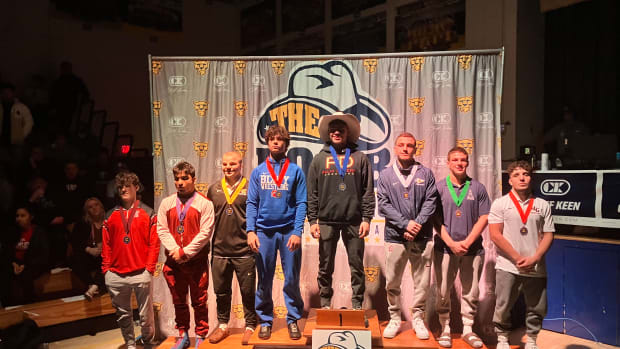 Gianni Maldonado (far right), from Lake Gibson, stands on the podium with all the medalist in the 160-pound division at the Don Buchanan Invitational in Clovis, California on Saturday. Maldonado, who is a defending state champion in Florida, finished seventh.