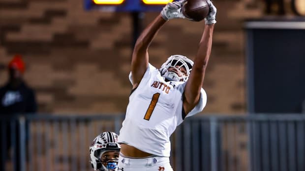 Hutto receiver Alex Green (1) makes the leaping grab in front of the Weiss defense November 2, 2023, at The Pfield in the district finale for both teams. Weiss prevailed with a 52-29 win.