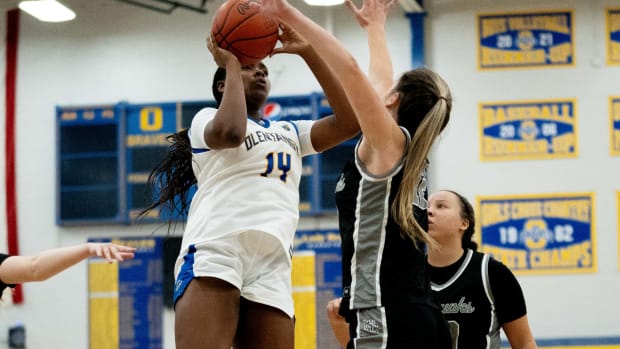 Dec 13, 2023; Lewis Center, Ohio, USA; Olentangy's Sydney Mobley (14) goes up for the layup against Westerville Central's Ella Martin (12) during their game on Wednesday, Dec. 13, 2023 at Olentangy High School.