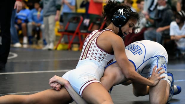 Lake Gibson’s Gabby Tedesco picks up a pivotal win in a 106-pound match against Tampa Jesuit to help deliver the Braves the FHSAA Class 2A Duals wrestling state championship on Saturday at the FHSAA Duals wrestling state championships at Osceola High School.