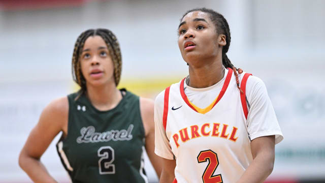 Purcell Marian's Dee Alexander and Laurel's Saniyah Hall look on during a game on January 11, 2023.