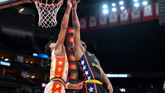 McDonald's All American West guard Isaiah Collier (4) shoots over McDonald's All American East guard D.J. Wagner (21) during the first half at Toyota Center.