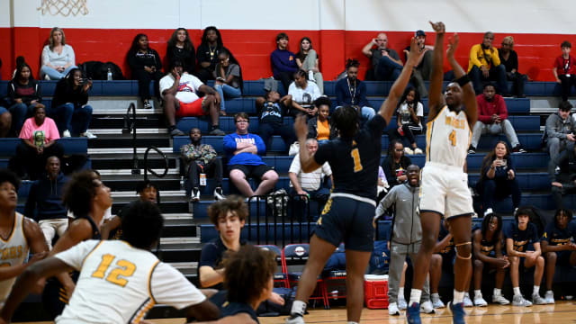 Winter Haven senior guard Isaac Celiscar fires up a jump shot during the first half of the championship game against St. Thomas Aquinas on Saturday at the Kingdom in the Sun Tournament at Vanguard High School in Ocala. 