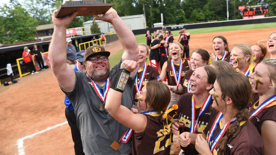 East Union coach Josh Blythe and the Lady Urchins celebrate the 2023 MHSAA Class 2A State Championship after a 3-1 win over Loyd Star on Friday, May 19 at the USM Softball Complex in Hattiesburg, Miss.