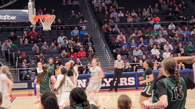 Laurel's Jordyn Meyer (No. 22 in green) watches as her layup goes in against Fairland in the OHSAA Division II state semifinals. The basket ended up being the game-winner for the Gators.