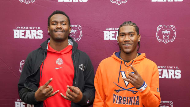 Lawrence Central's Joshua Mickens (Ohio State) and Trent Baker-Booker (Virginia) signed with college football programs Wedneday.