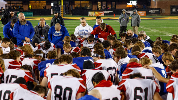 Valle Catholic and Lamar pray together following the 2023 Missouri Class 2 championship game