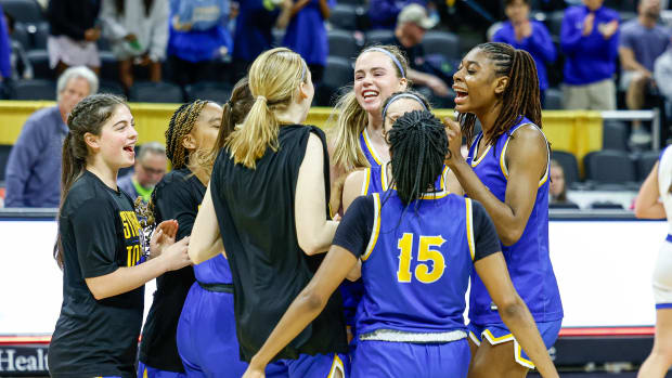 John Burroughs celebrates its Missouri Class 5 girls basketball semifinal win.