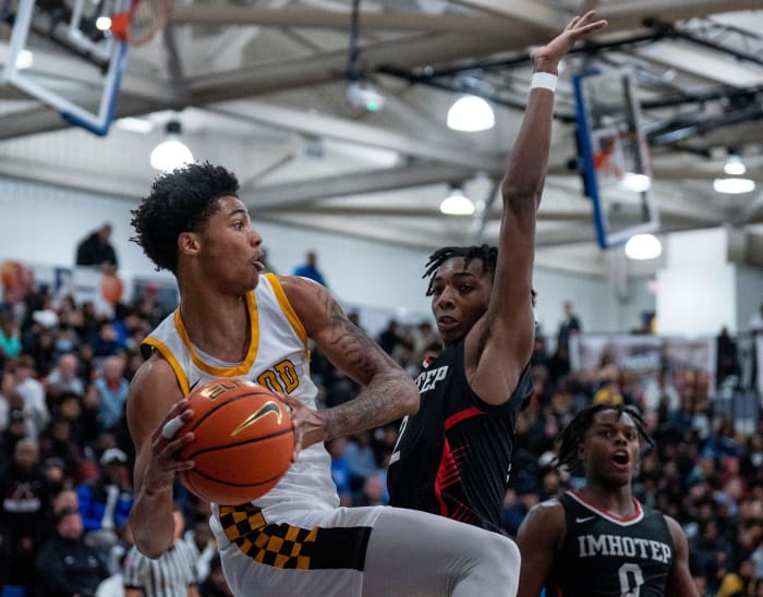 Archbishop Wood's Jalil Bethea (1) looks to pass the ball against Imhotep Charter's Carnell Henderson (2) in the Diane Mosco Shootout in Bensalem on Friday, Dec. 22, 2023. Daniella Heminghaus | Bucks County Courier Times