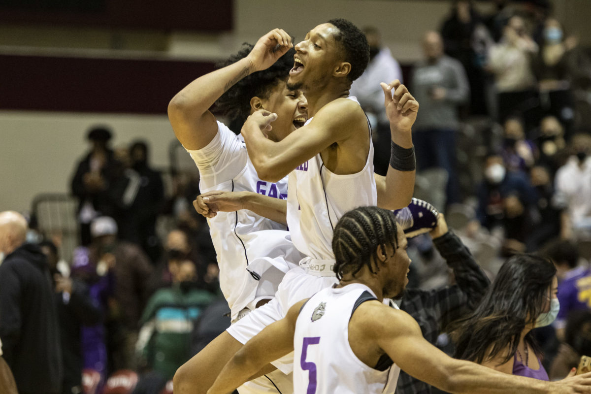 Massey (center) celebrates with teammates after Garfield beat Seattle Prep in the Metro League title game in February.