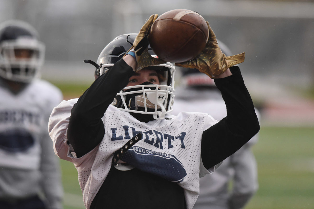 The Liberty High School football team practices Thursday, Feb. 25, 2021 in Hillsboro, Ore.