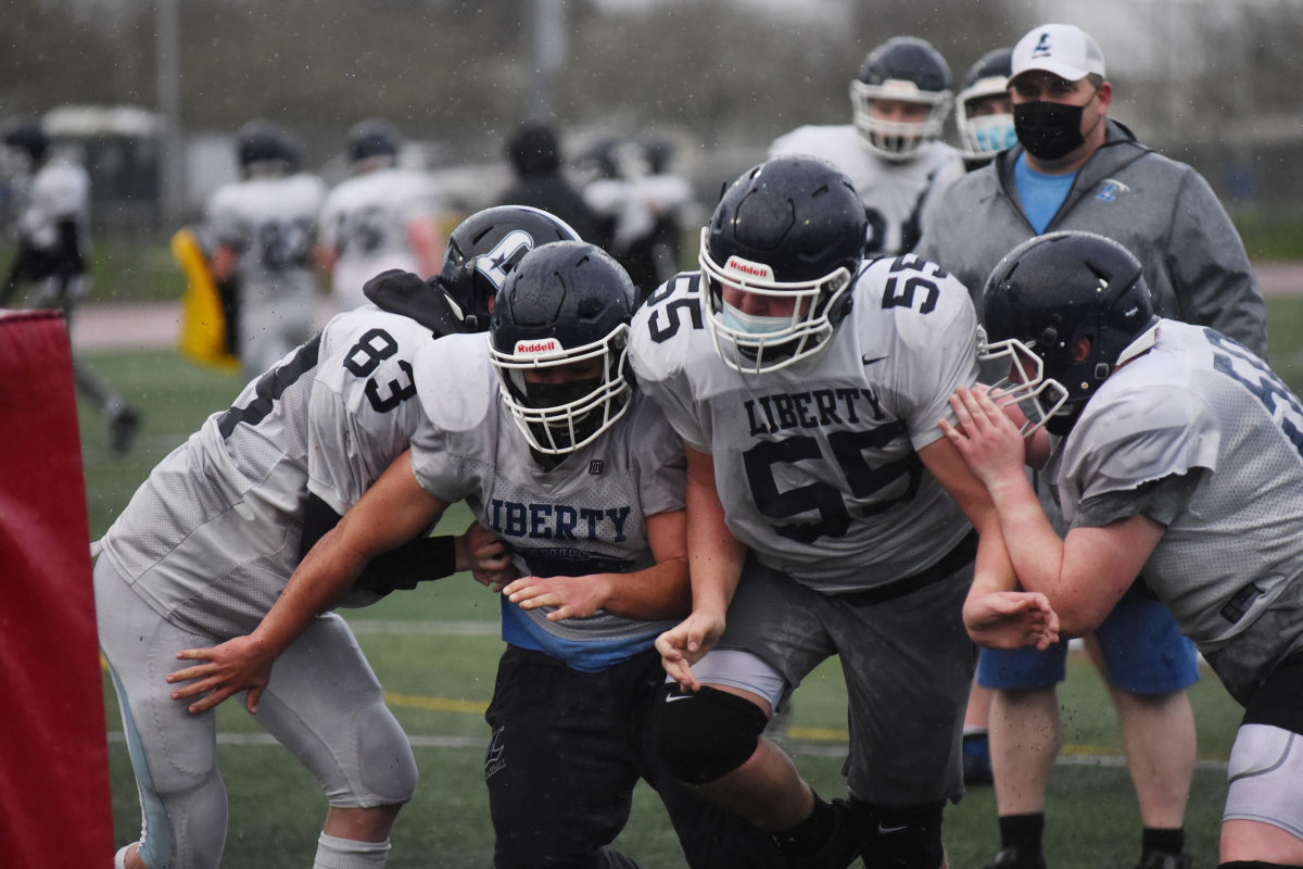 The Liberty High School football team practices Thursday, Feb. 25, 2021 in Hillsboro, Ore.