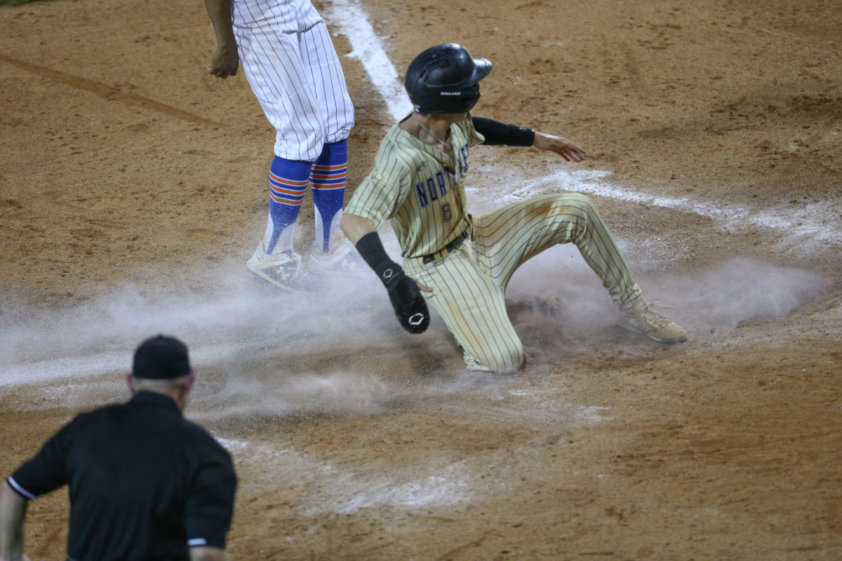 Northwest Rankin's Nick Monistere (8) scores in the fourth inning to give Northwest Rankin a 1-0 lead. Madison Central and Northwest Rankin played in game 1 of the MHSAA Class 6A Baseball Championship on Thursday, June 4, 2021 at Trustmark Park. Photo by Keith Warren