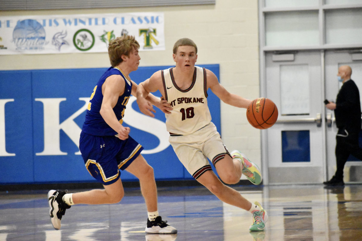 Mt. Spokane's Ryan Lafferty moves the ball against Tahoma in the Curtis Winter Classic. (Photo by Andy Buhler)