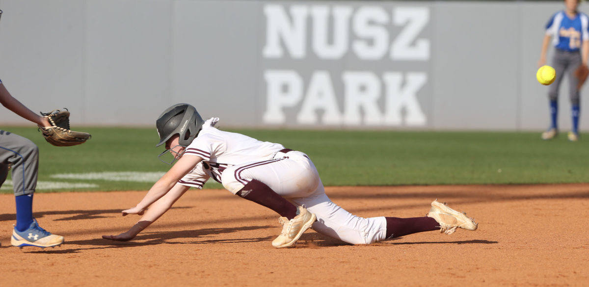 Raleigh High School's Kayley  Revette (9) dives into second base. Booneville and Raleigh played in game two of the MHSAA Class 3A Baseball Championship at Mississippi State University on Thursday, May 13, 2021. Photo by Keith Warren